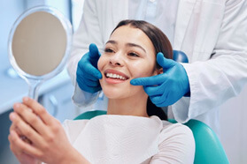 Woman smiling after treatment  